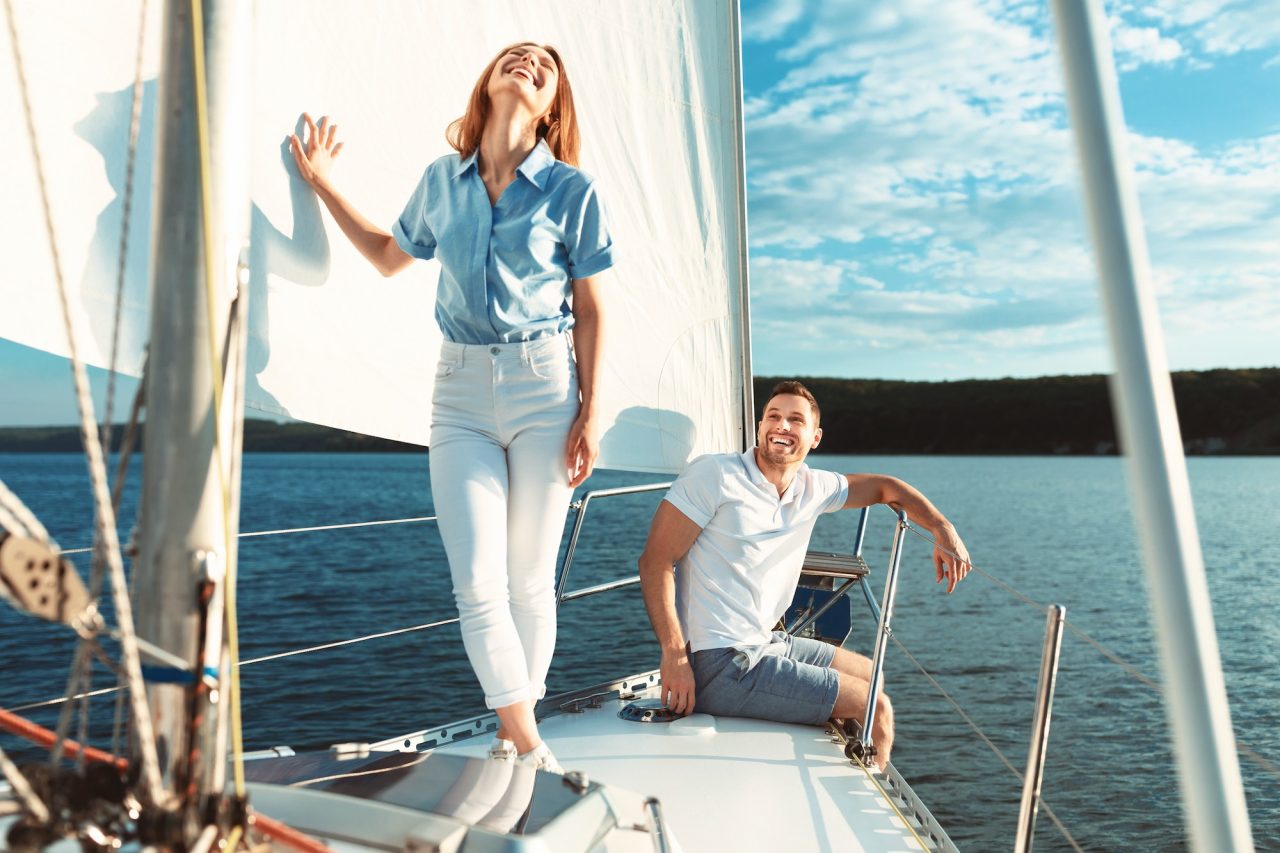 couple-having-fun-on-luxury-yacht-enjoying-boat-tour-outdoors